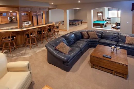 Finished basement rec room with bar area, showing the potential of a converted Hamilton lower level