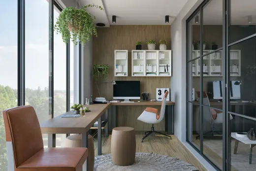 Renovated lower-level home office with glass walls and bright, even lighting
