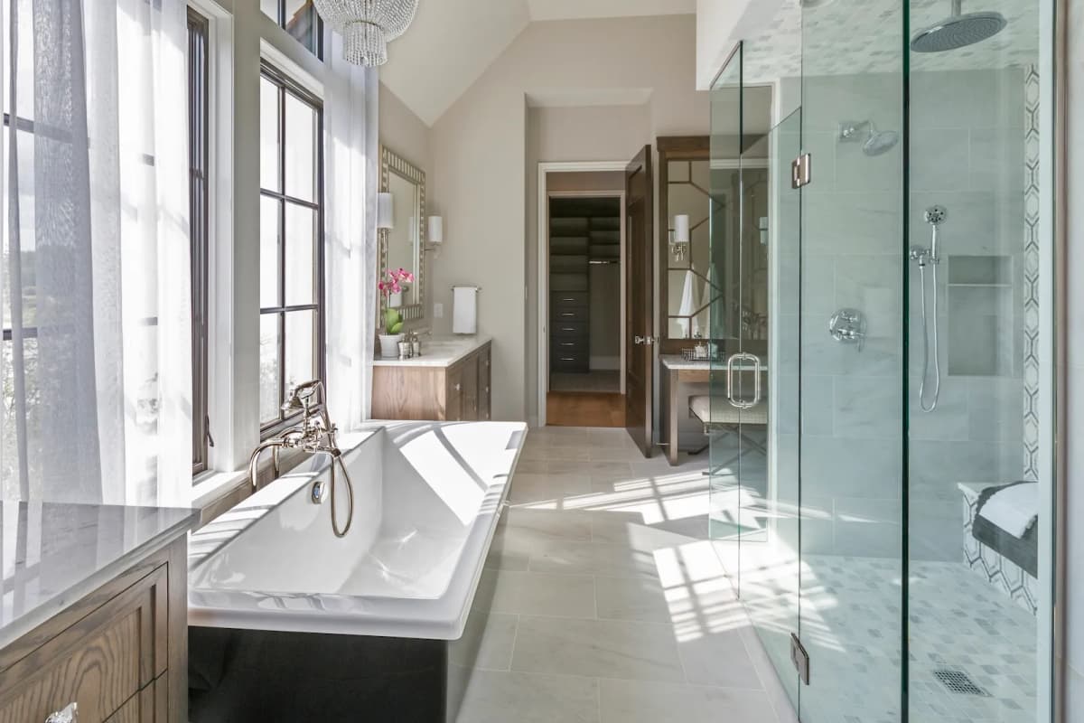 Luxury freestanding tub in ensuite renovation with marble tile in Toronto