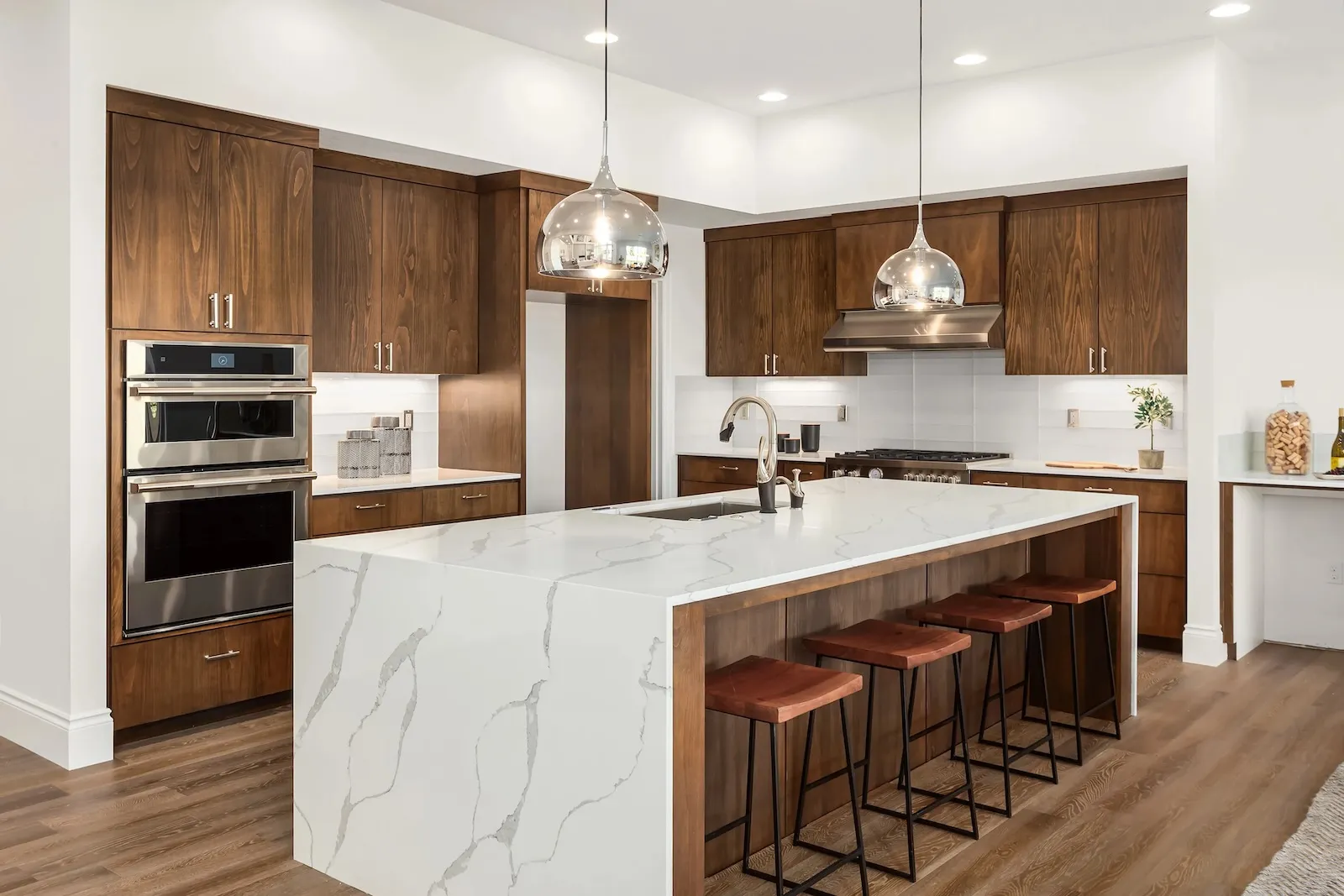 Luxury vinyl plank flooring installation in modern kitchen by Leo Constra in Toronto