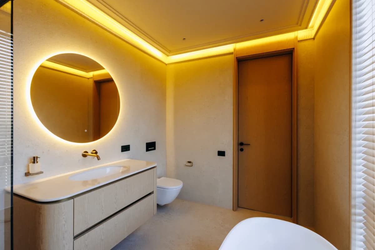 Bathroom renovation with heated floors and custom lighting in Ontario