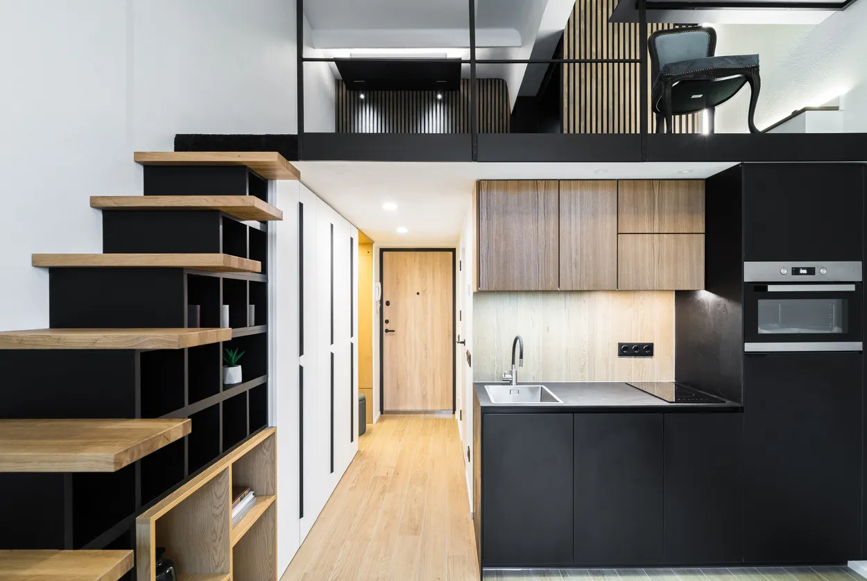 Condo renovation custom layout with open shelving and black cabinetry in Ontario
